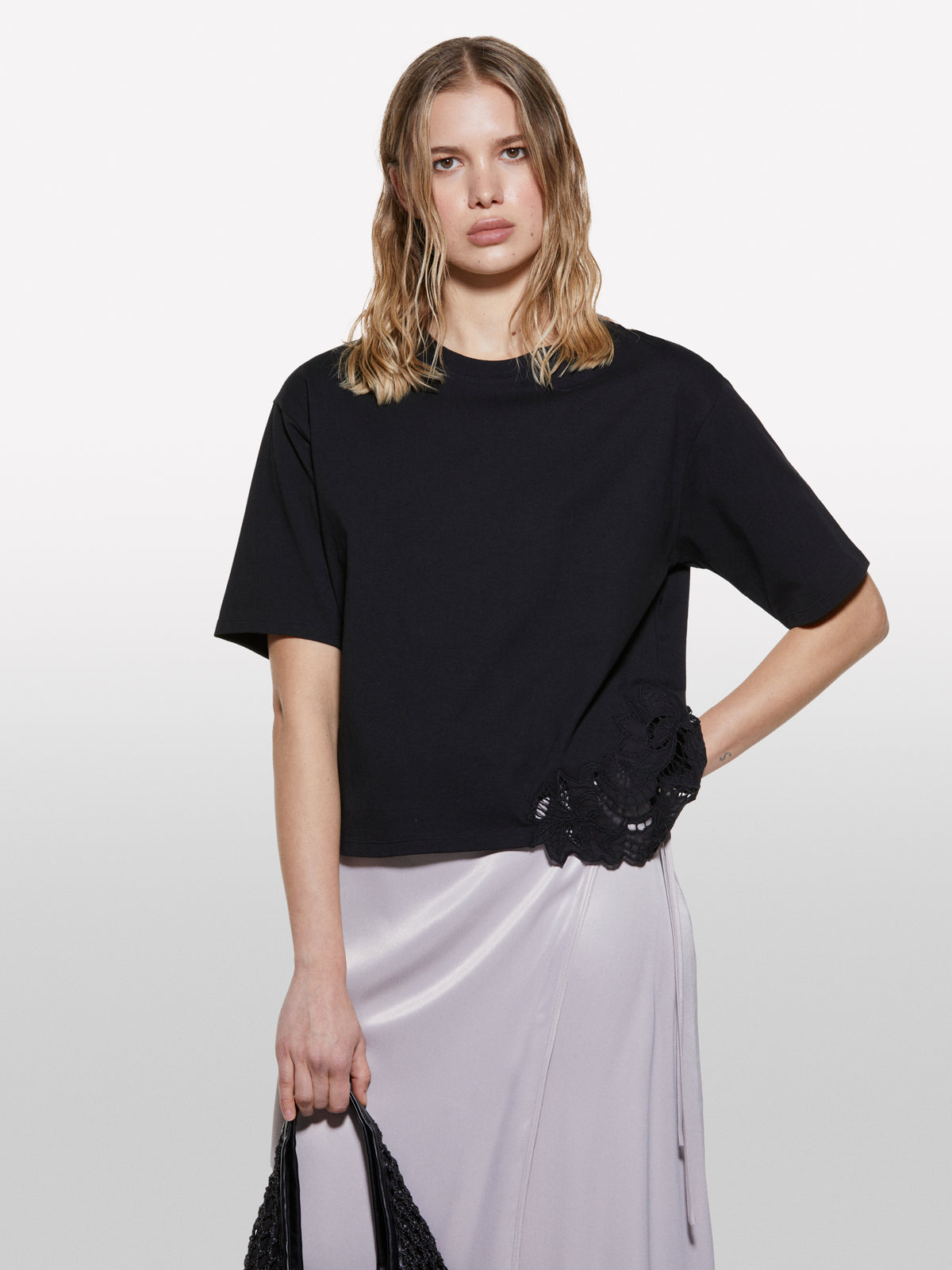 Black t-shirt with uneven embroidery