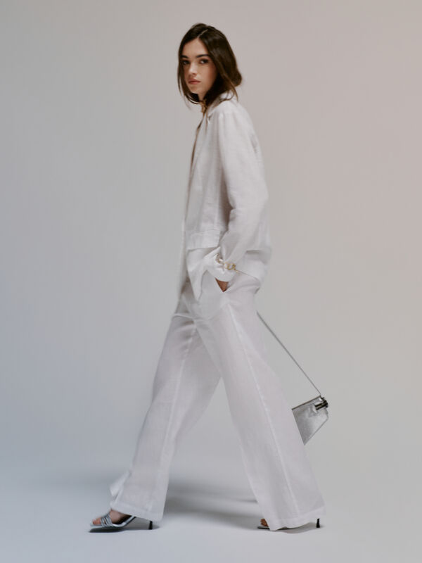 Pantaloni bianchi flare fit in 100% lino - pantaloni palazzo da donna | Sisley