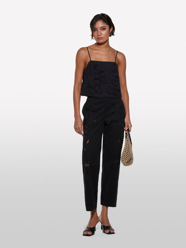 Top cropped nero con fiori Top cropped nero con fiori - top da donna | Sisley