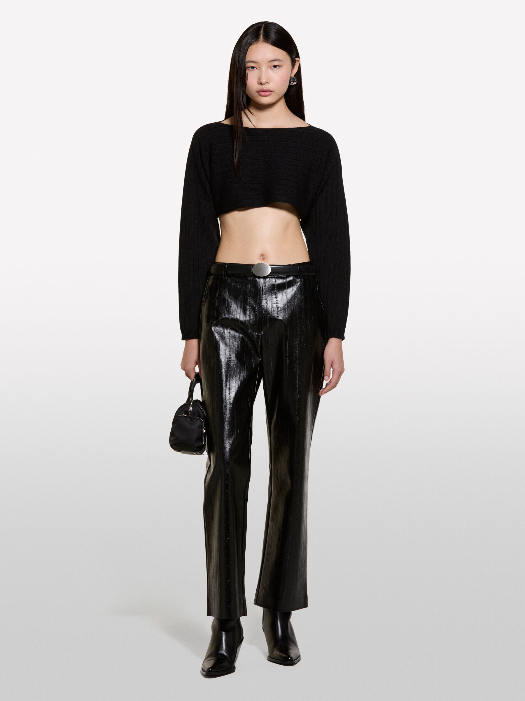 Coprispalle nero in maglia Nero Sisley