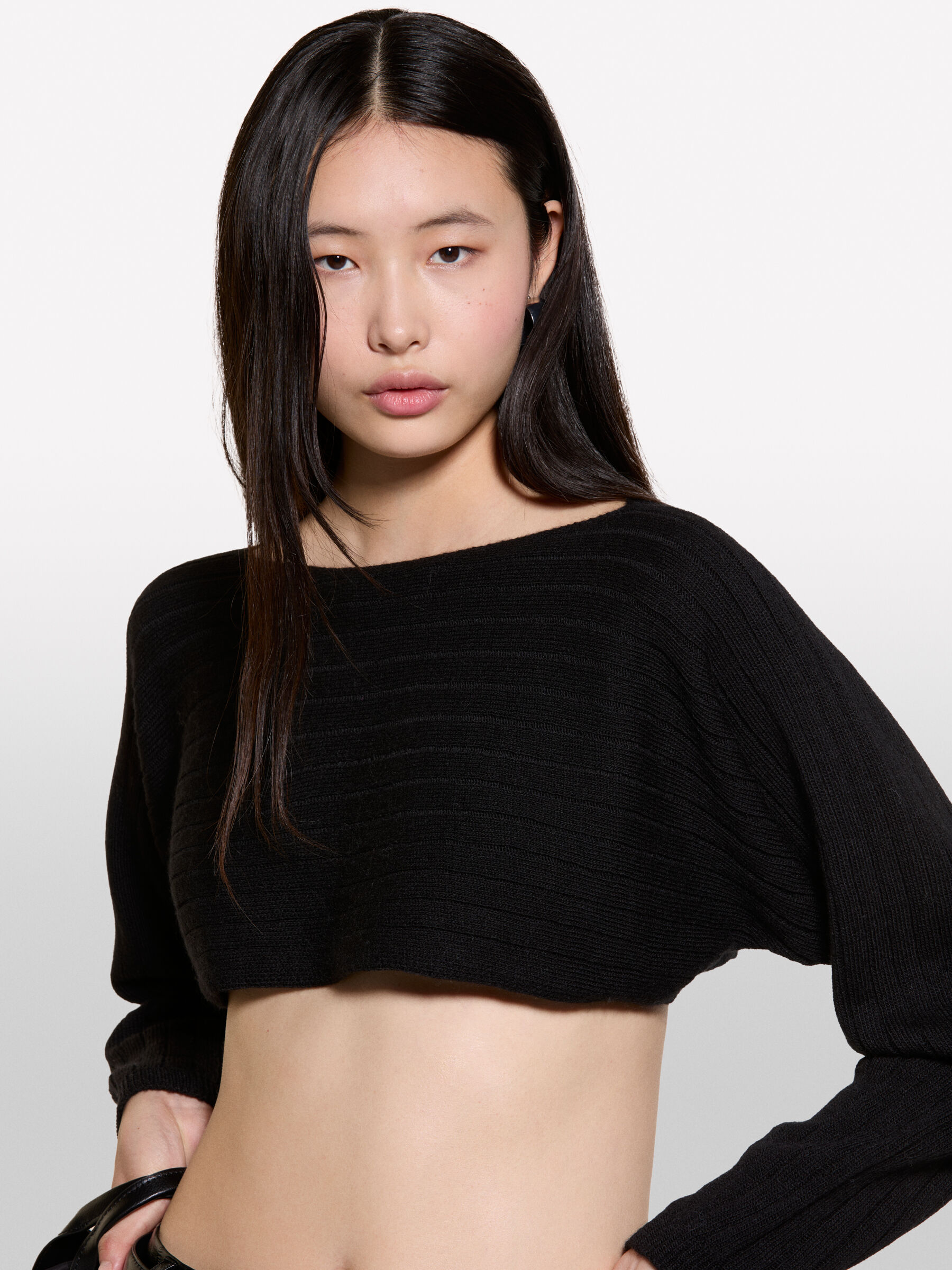 Coprispalle nero in maglia Nero Sisley
