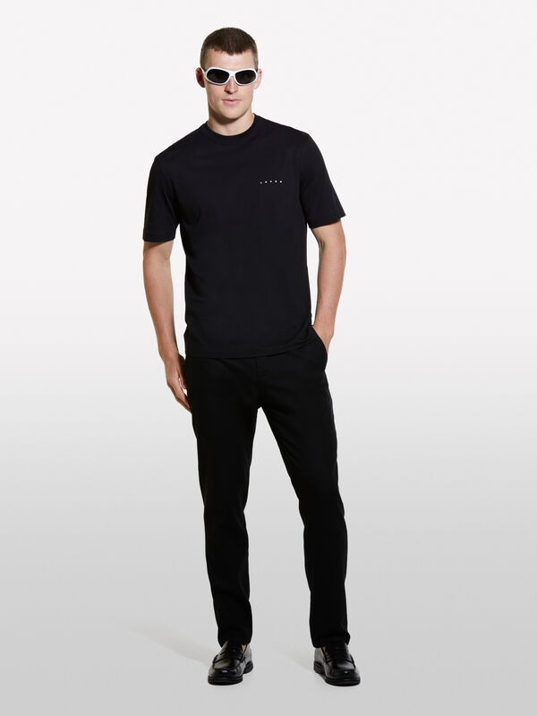 T-shirt nera con stampa lettering 100% cotone  - t-shirt a manica corta da uomo | Sisley