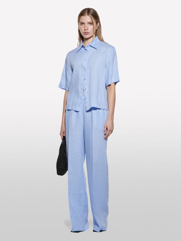 Pantaloni azzurri flare fit in 100% lino - pantaloni palazzo da donna | Sisley